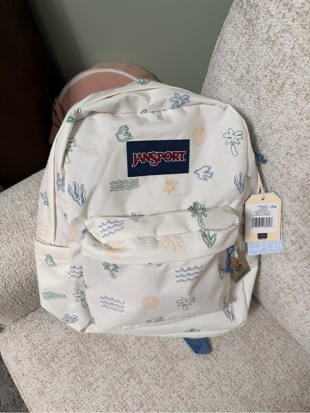 JanSport Cream Backpack with Blue Logo and Pastel Tropical Motifs - Picture 1 of 2